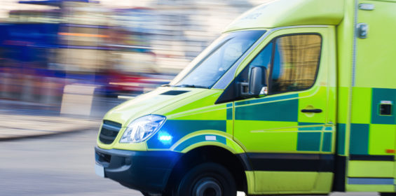 Facilities management healthcare case study showing a picture of a speeding ambulance